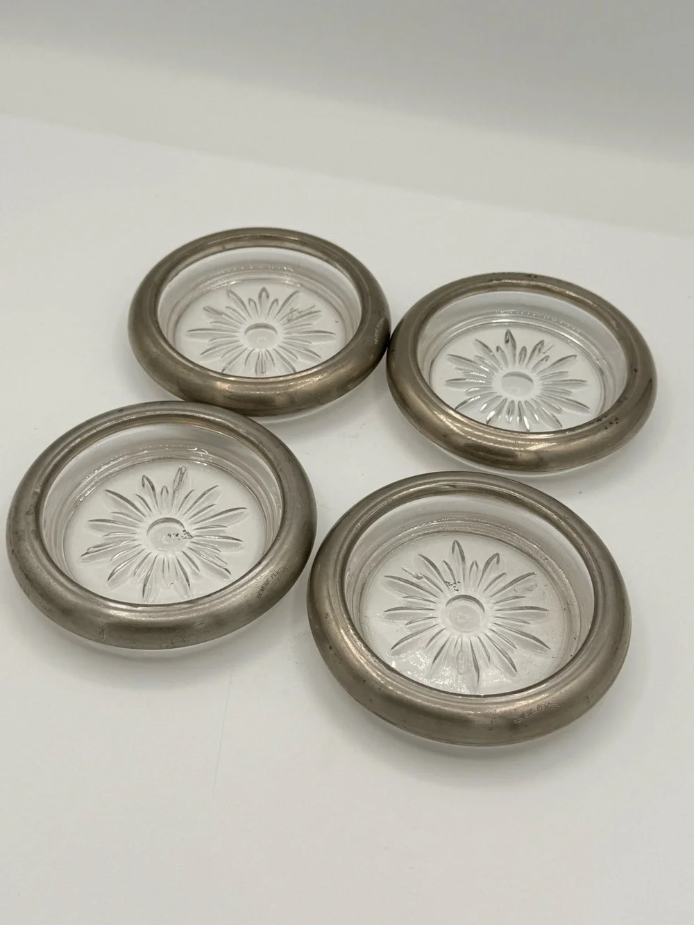 Engraved Leonard Revere Pewter coasters with decorative glass inserts